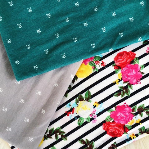 Gray with White Arrows - Stretchy Cotton (in middle of photo)